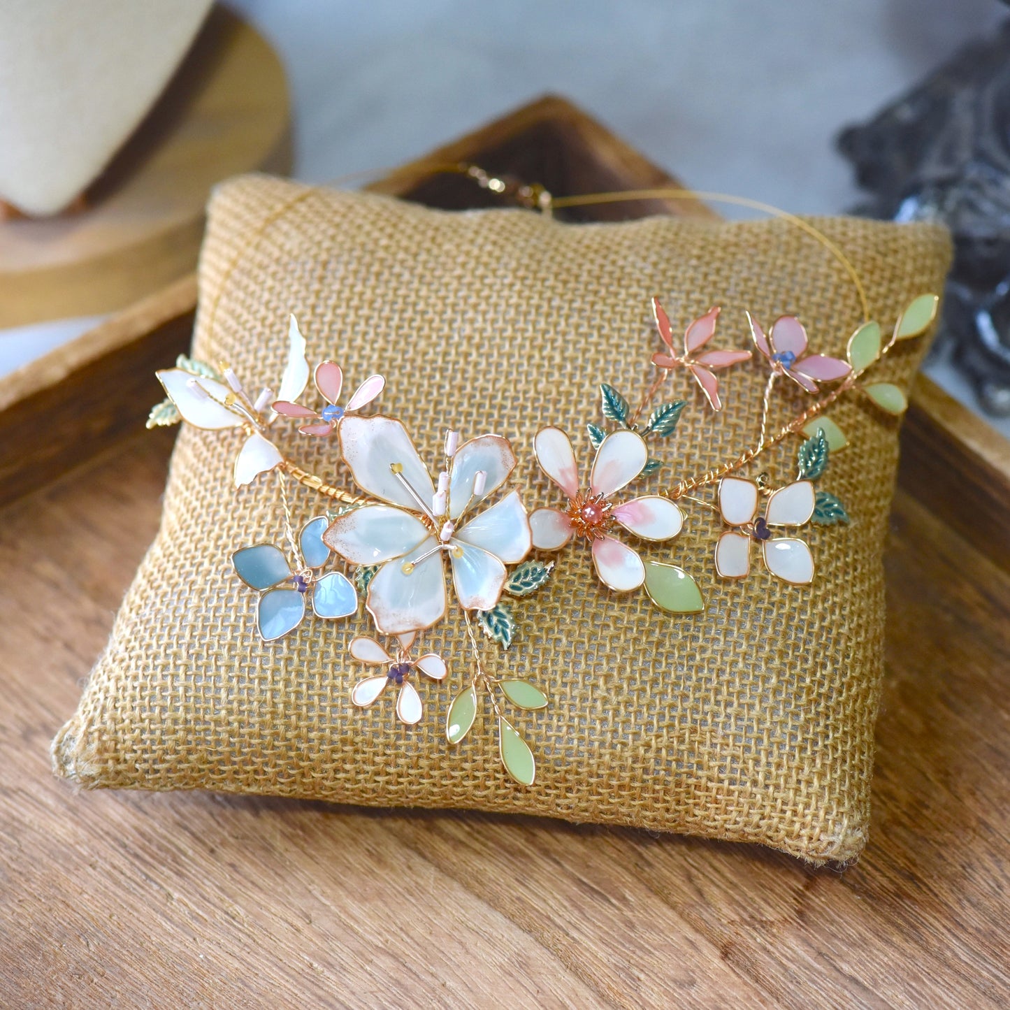 Close-up view of Candace floral resin necklace showcasing layered pastel petals, delicate bead accents and handcrafted gold wirework