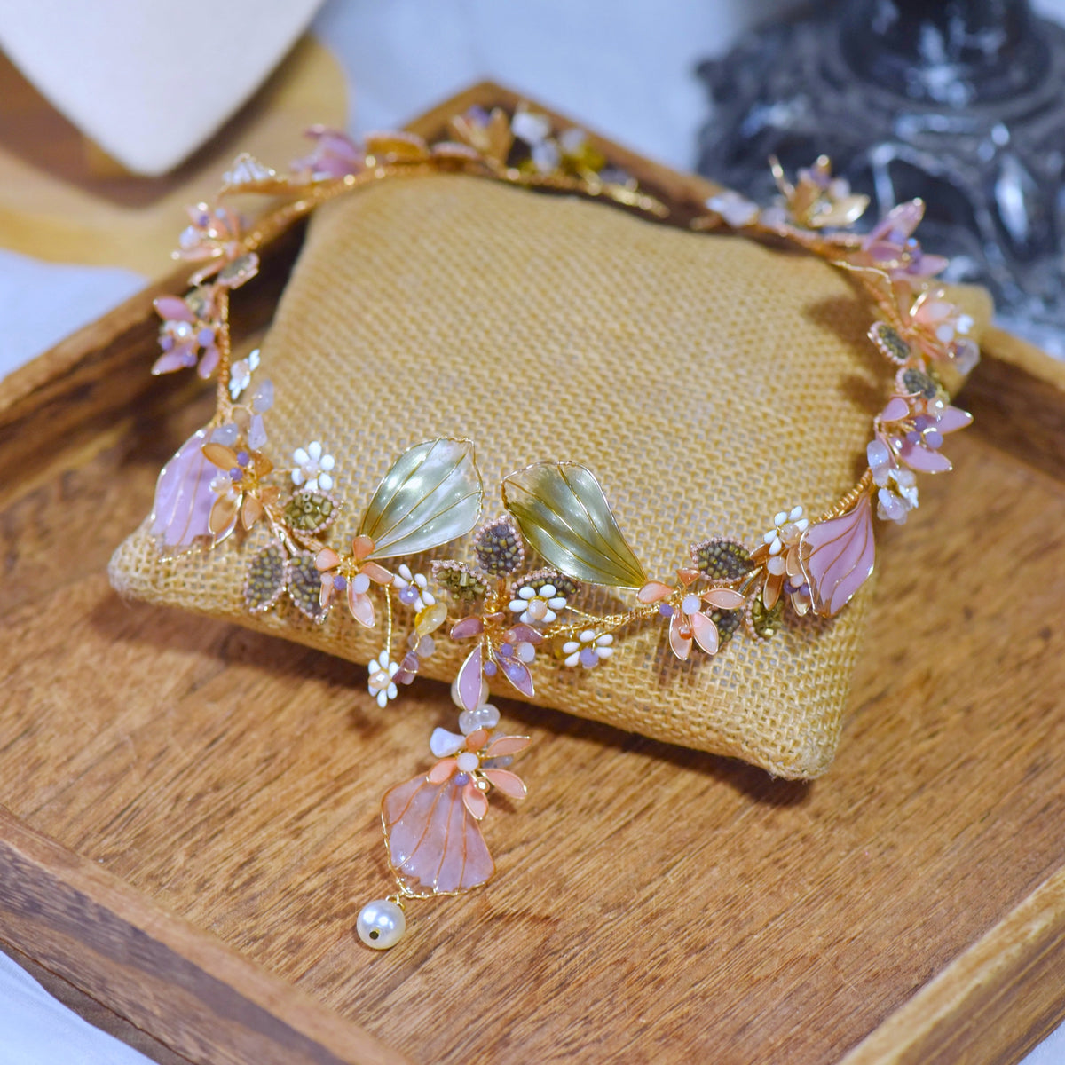 Close view of the Catriona head harness showing lavender petals, green leaves and golden wirework