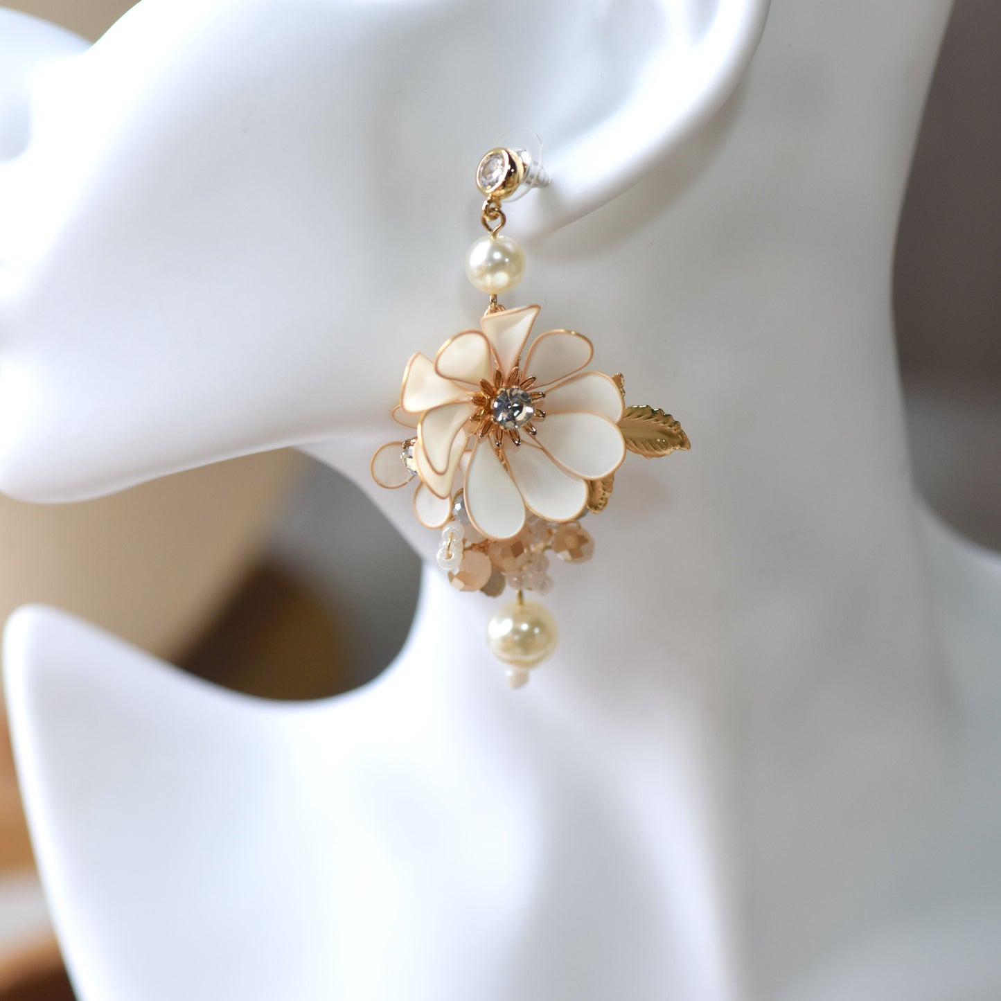 Odette handcrafted white resin floral pearl drop earrings ivory champagne gold on mannequin bridal styling