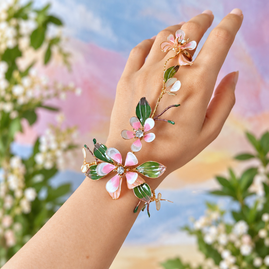 a resin floral haathphool worn on hand against a vibrant background