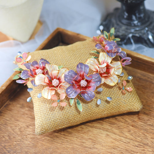 Adelei purple and pink resin floral bridal headband with mint accents on jute cushion
