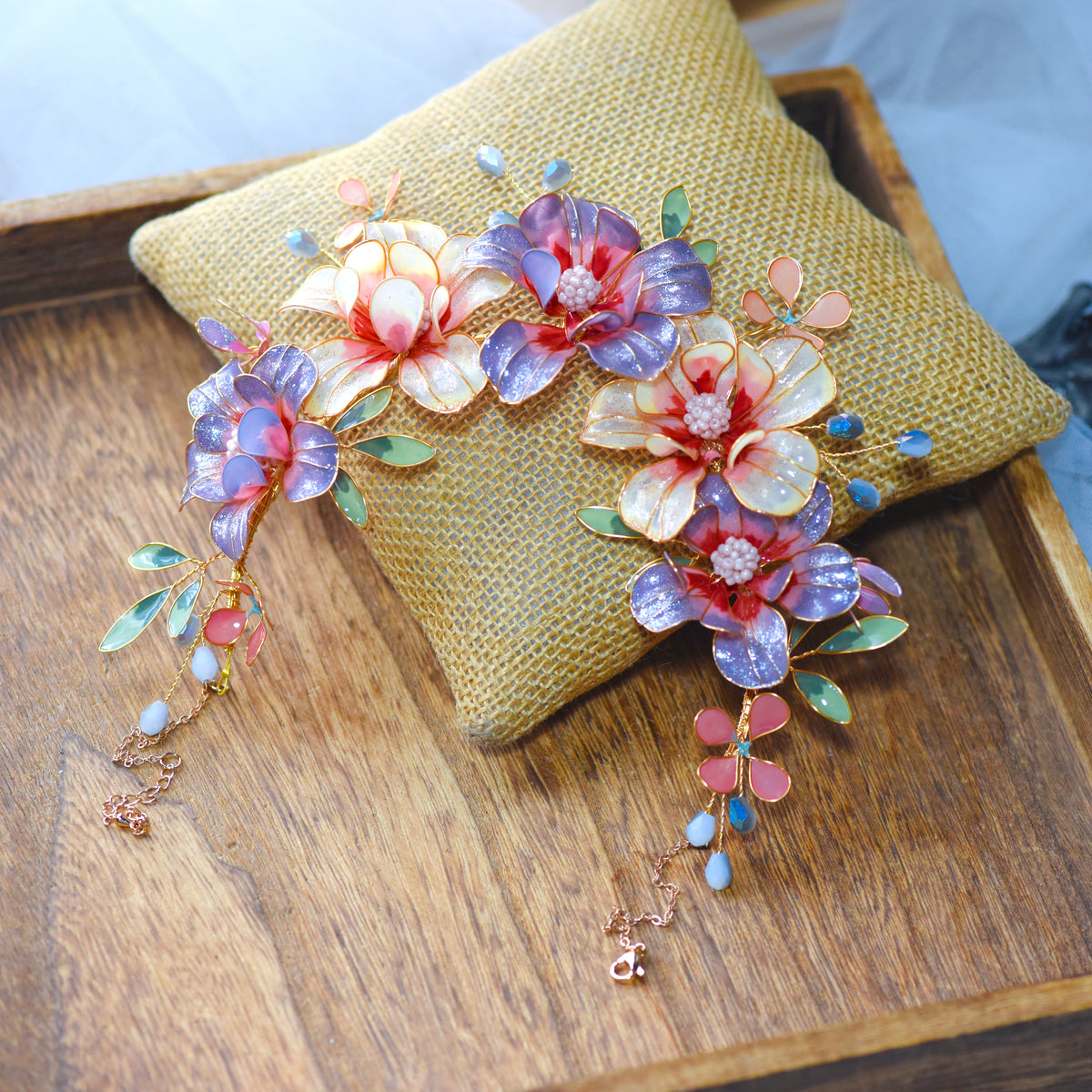 Adelei purple resin floral statement necklace draped on jute cushion