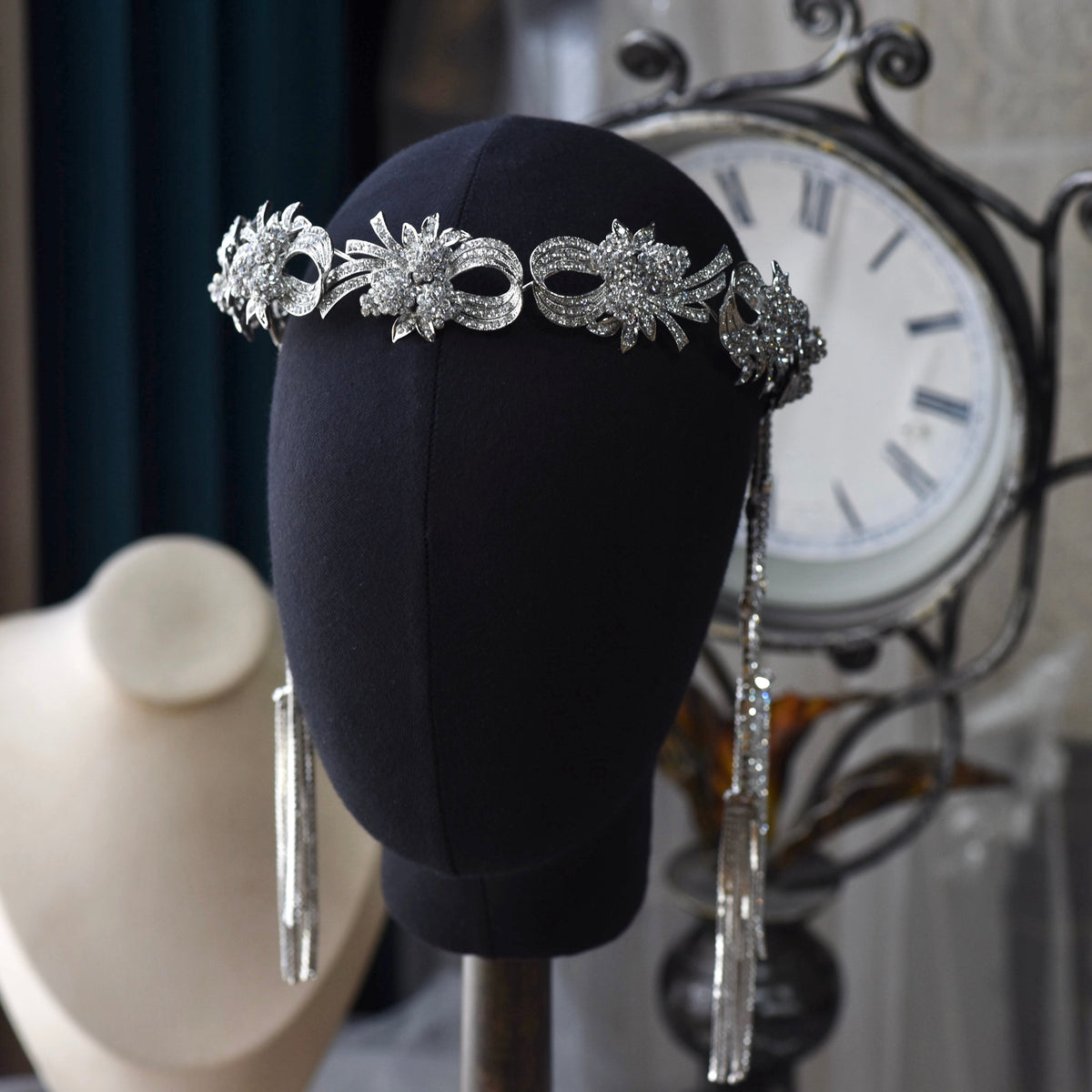 Alaia crystal and pearl floral bridal headband detail on display stand
