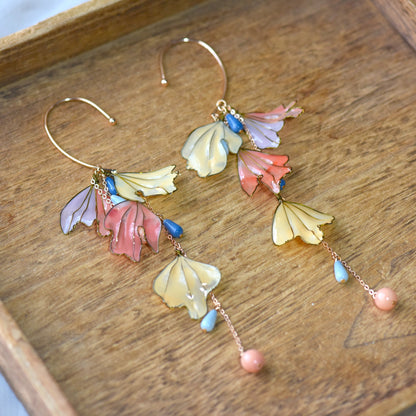 Close-up of Alicia handcrafted floral ear cuff showing glossy resin petals, pastel bead accents and intricate gold finish