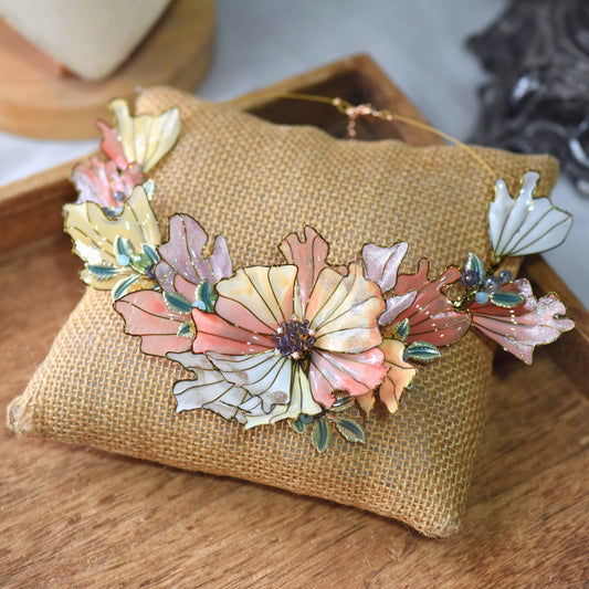 Alicia handcrafted floral resin necklace featuring layered blush pink, coral peach and ivory petals with soft gold wire detailing