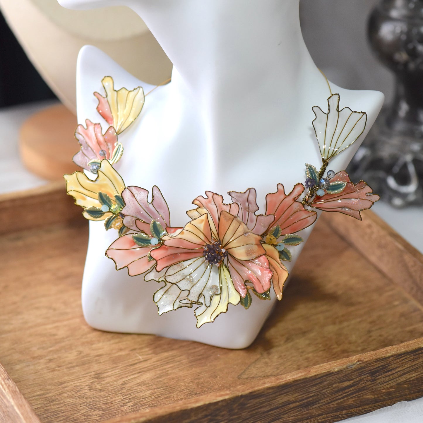 Close-up view of Alicia floral resin necklace showcasing layered petals, glossy resin finish and intricate handcrafted gold wirework