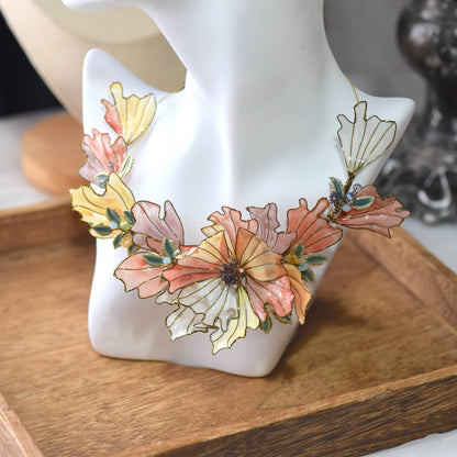 Close-up view of Alicia floral resin necklace showcasing layered petals, glossy resin finish and intricate handcrafted gold wirework