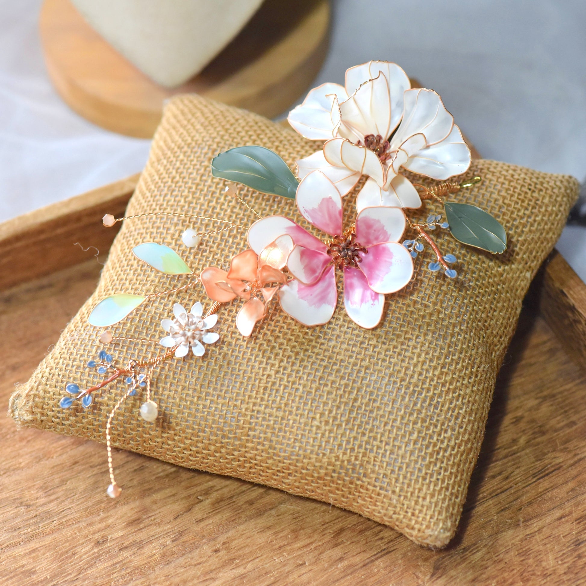 Aneira handcrafted floral hair accessory with blush pink resin petals and botanical detailing