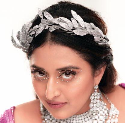 Raja Kumari in the Apollo silver zirconia leaf headband, angled view showing the thick sculptural band
