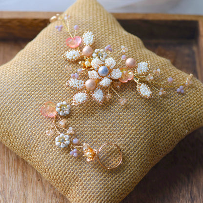 Arabella handcrafted metal bead floral haath phool hand harness golden cream blush pink pearl flat lay burlap cushion
