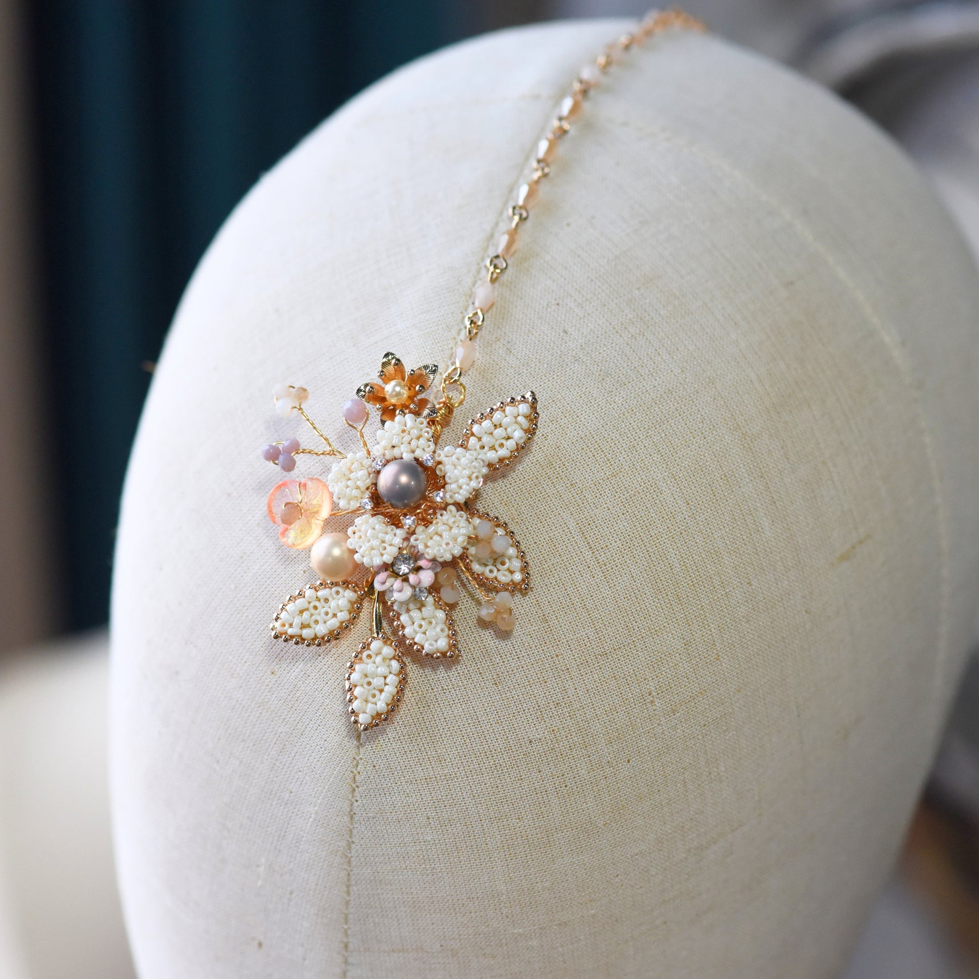 Arabella handcrafted metal bead pearl maang tika floral bead detail golden cream lavender blush close-up
