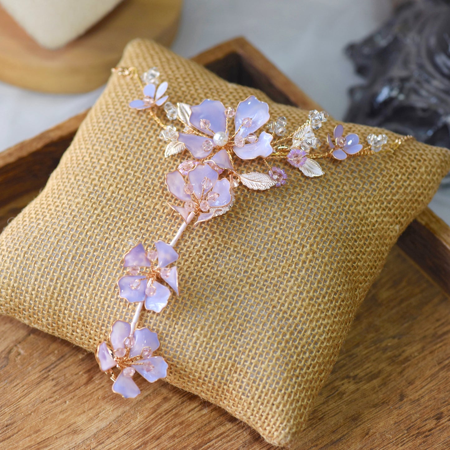 Belle lavender resin floral bridal hand harness haath phool in lilac on jute cushion
