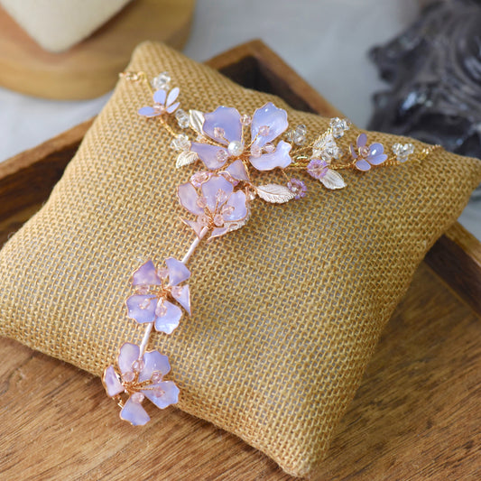 Belle lavender resin floral bridal hand harness haath phool in lilac on jute cushion
