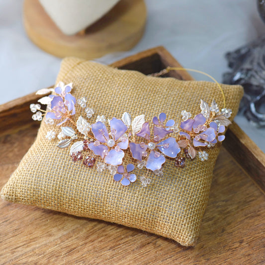 Belle lavender resin floral statement bridal necklace in lilac on jute cushion

