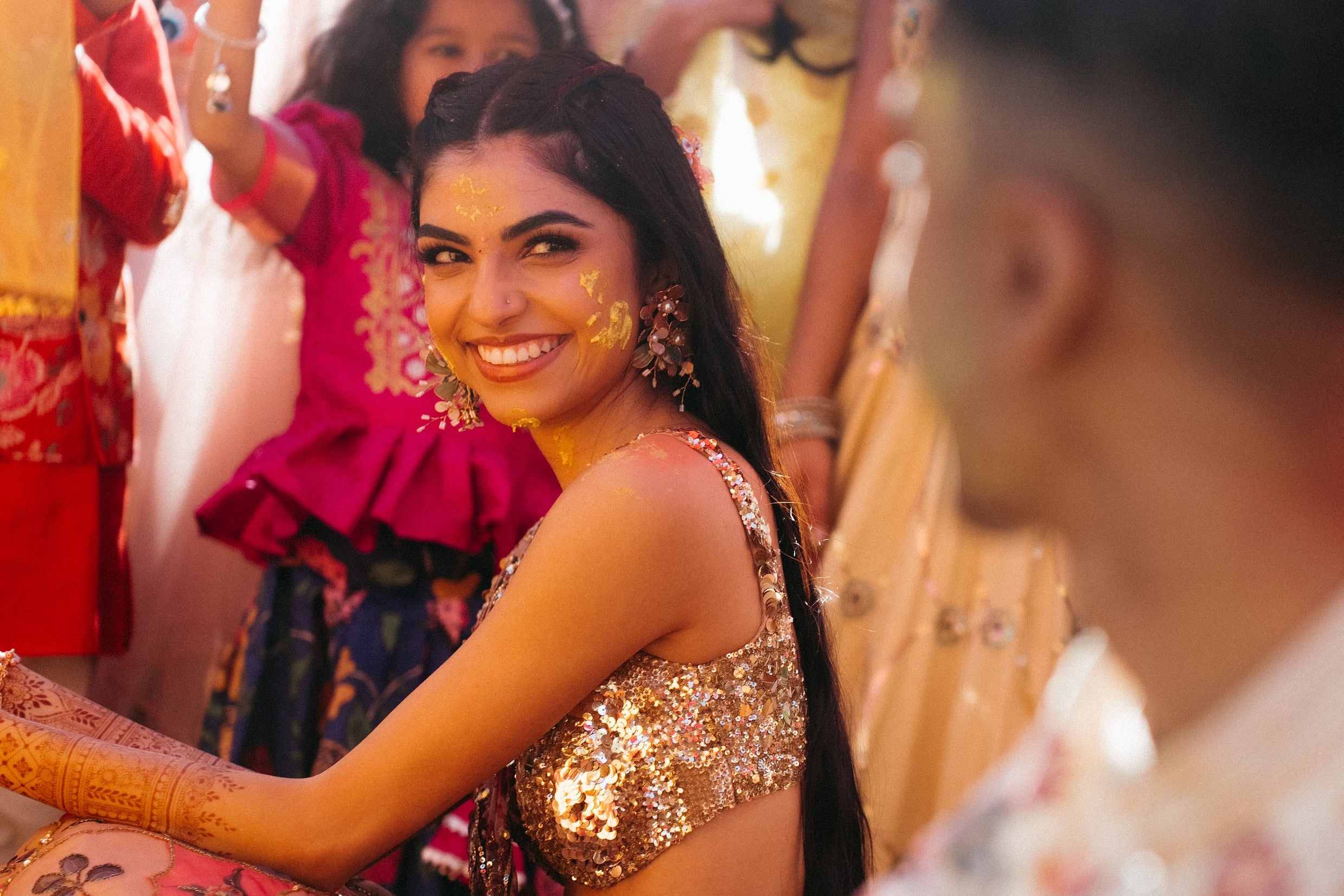 south asian bride from new york wearing floral jewellery for her haldi wedding event