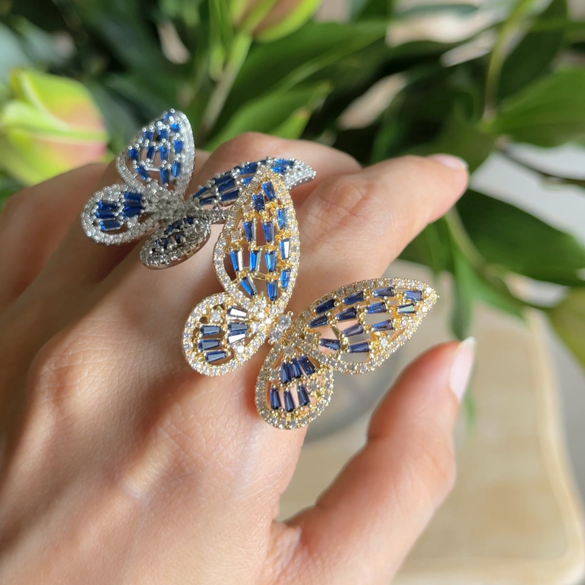 Butterfly Ring II zirconia butterfly ring in golden and blue  and silver and blue on hand
