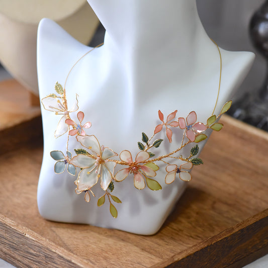 Candace handcrafted floral resin necklace featuring blush pink and ivory flowers with pastel green leaves and soft gold wire detailing