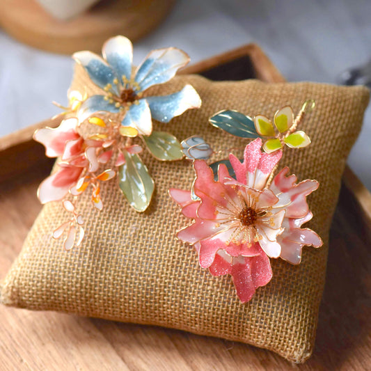 Cassandra handcrafted resin floral hair clips set powder blue pink white green gold flat lay burlap cushion
