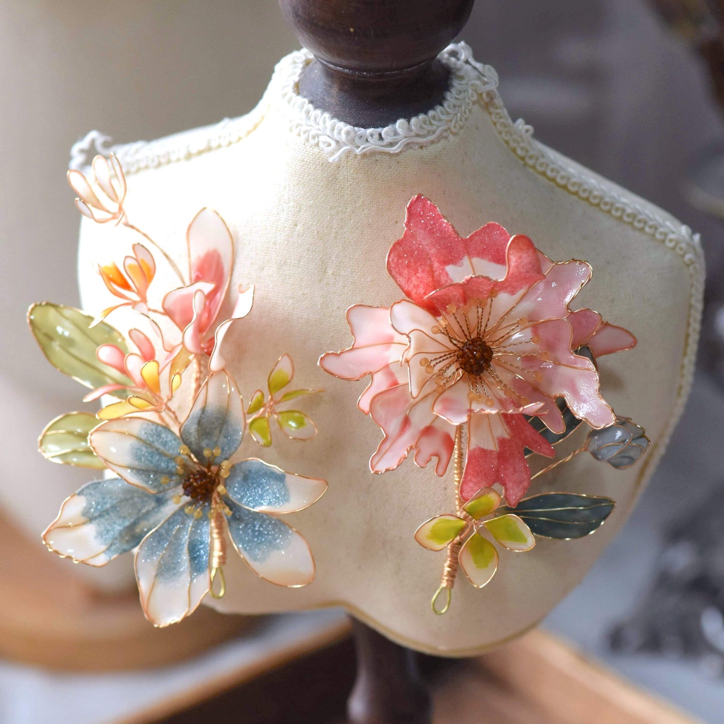 Cassandra handcrafted resin floral bridal hair clips powder blue pink white teal green gold on white bust
