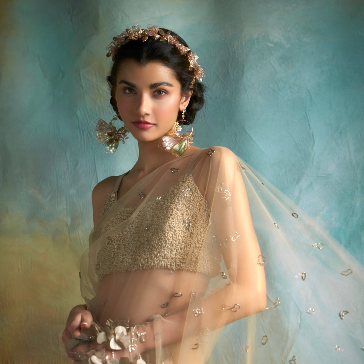 Model wearing Catriona lavender and green floral statement earrings in an editorial portrait
