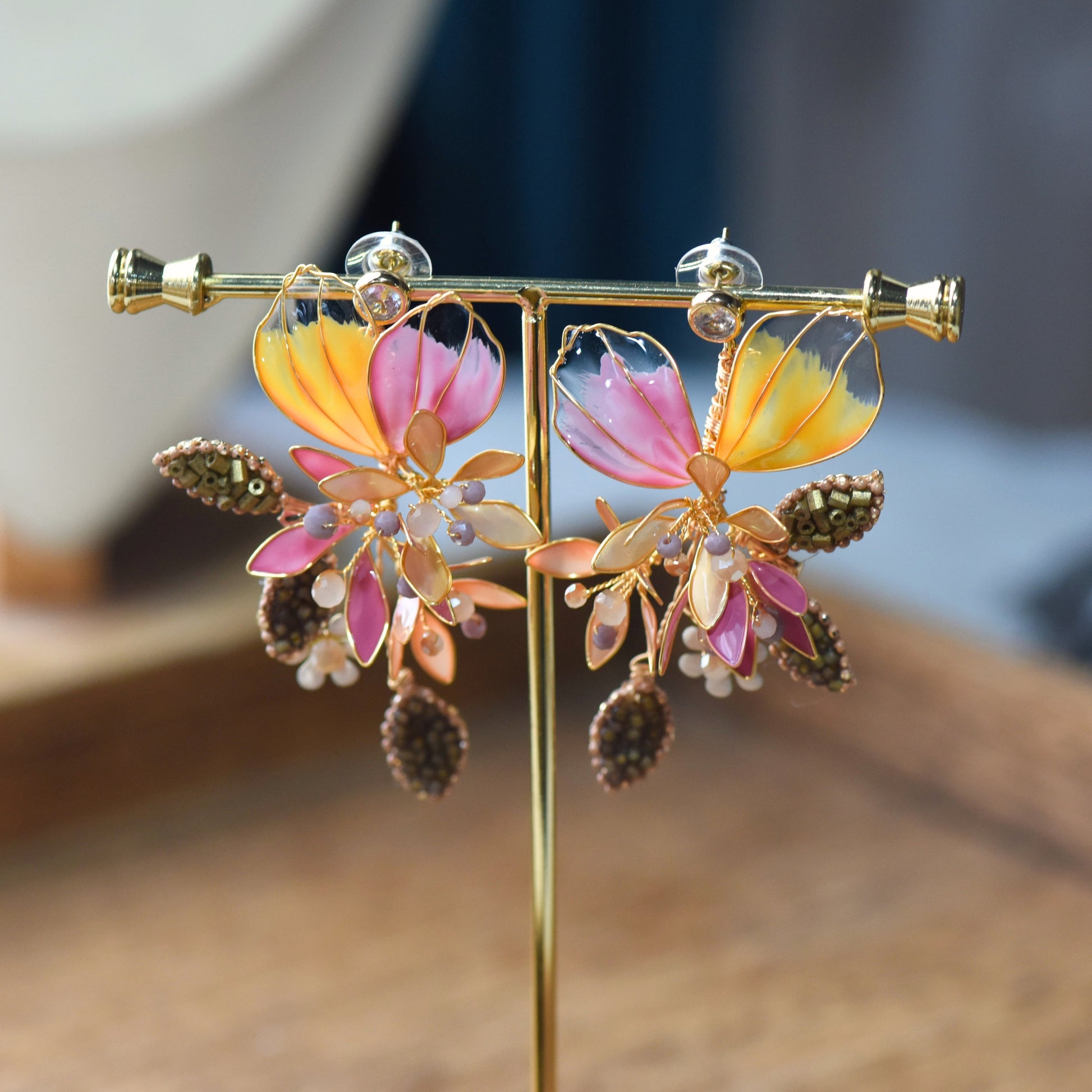 Catriona handcrafted floral drop earrings with pink and orange resin petals and bead detailing