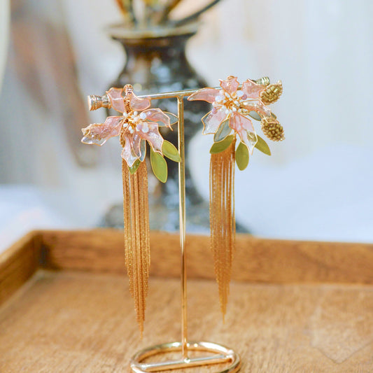 Celestina handcrafted resin floral drop earrings pink gold green leaf chain drops on gold stand
