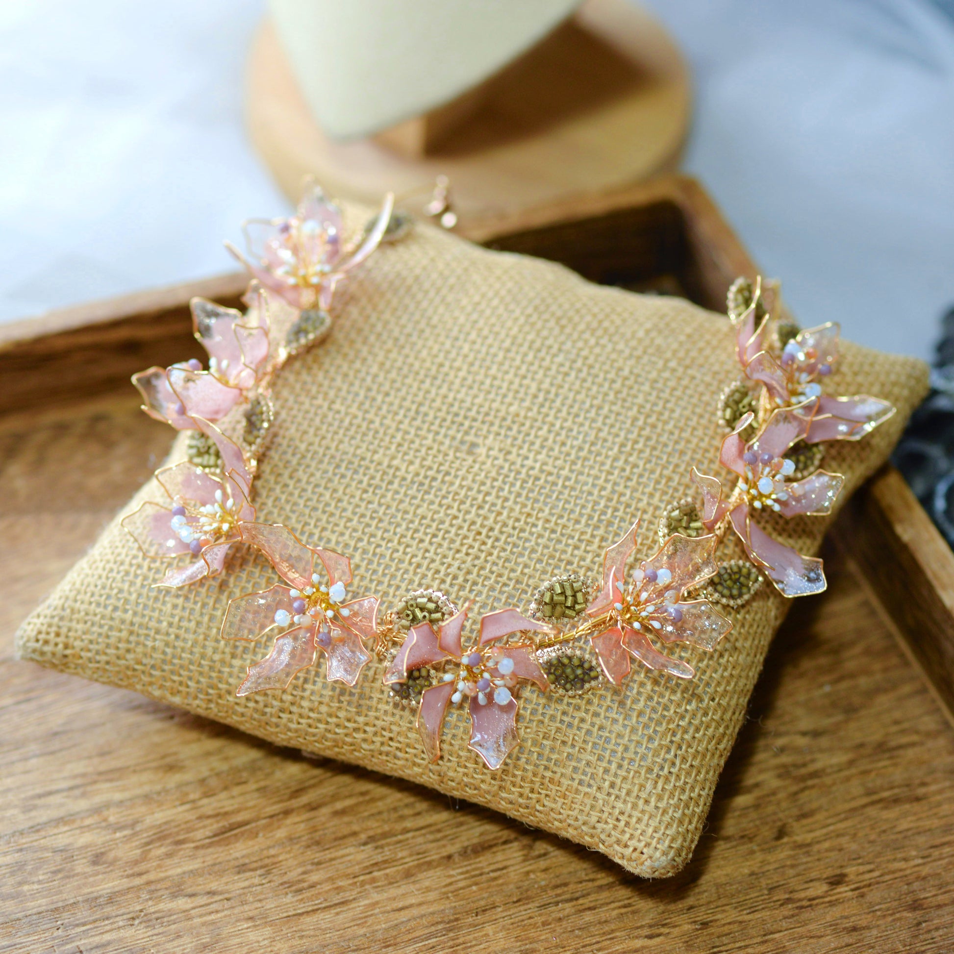 Celestina handcrafted resin floral necklace pink gold close-up petal detail copper wirework
