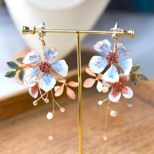 Clara handcrafted floral earrings with pastel resin petals and botanical detailing