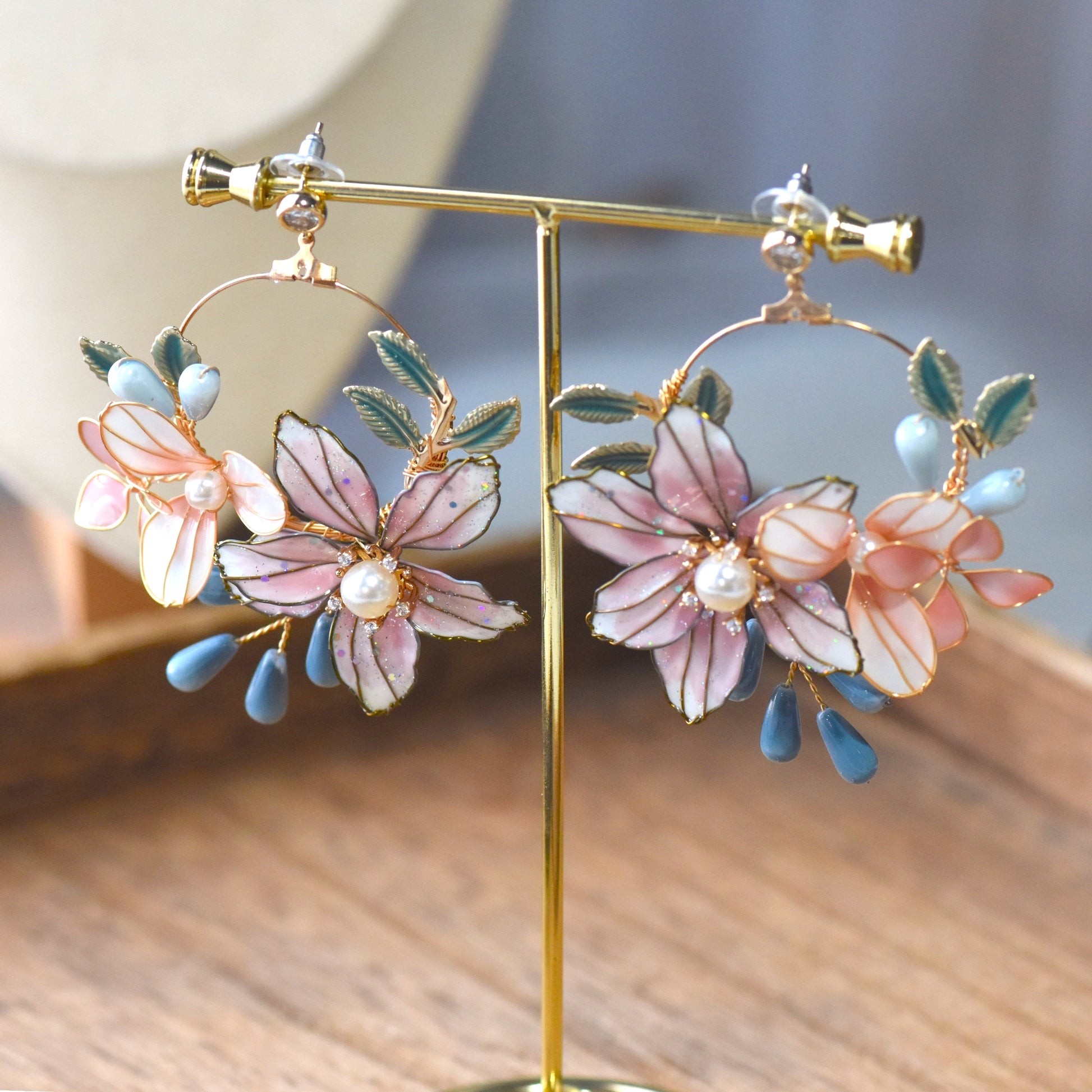 Dahlia floral earrings with pastel resin petals pearl center and blue bead drops