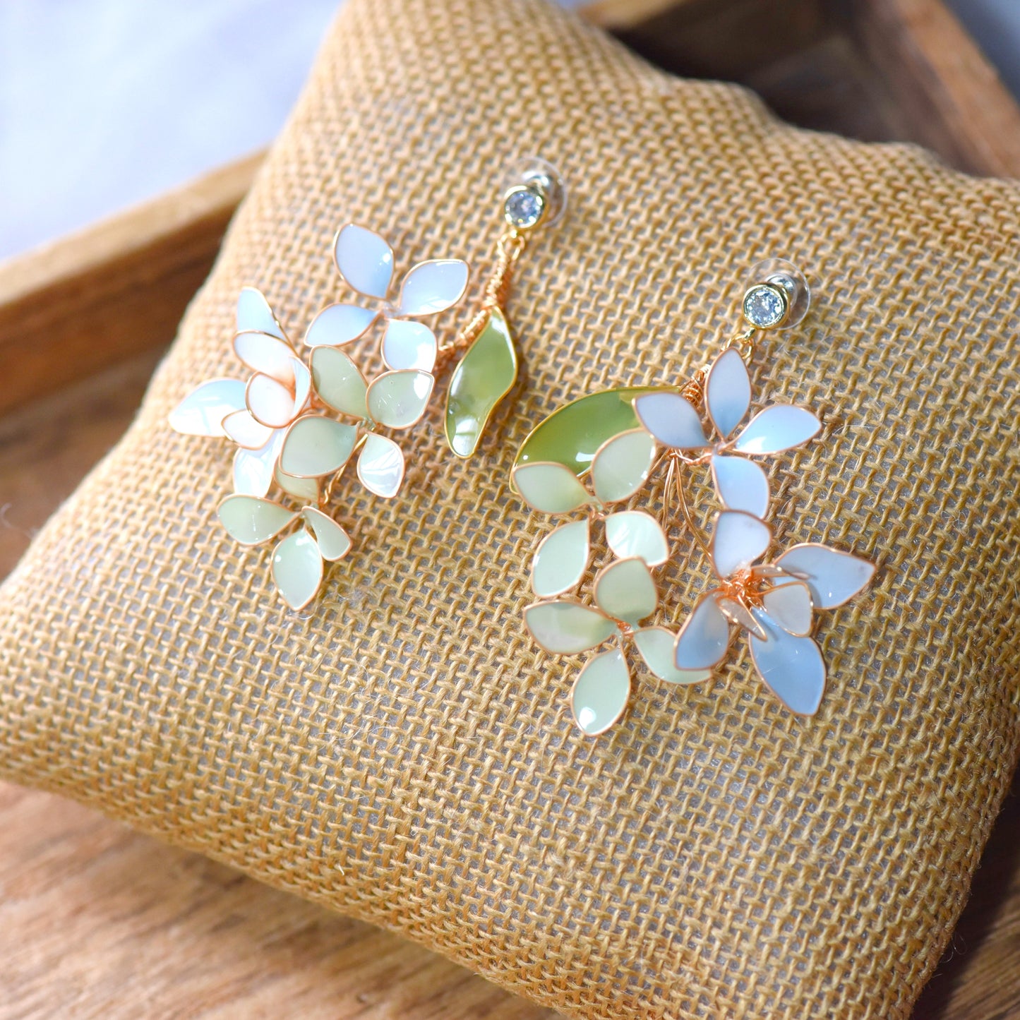 Handcrafted pastel floral earrings with resin petals and gold wire detailing