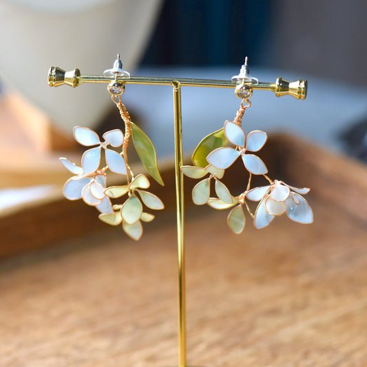 Fawn handcrafted floral earrings with pastel resin petals and botanical leaf design