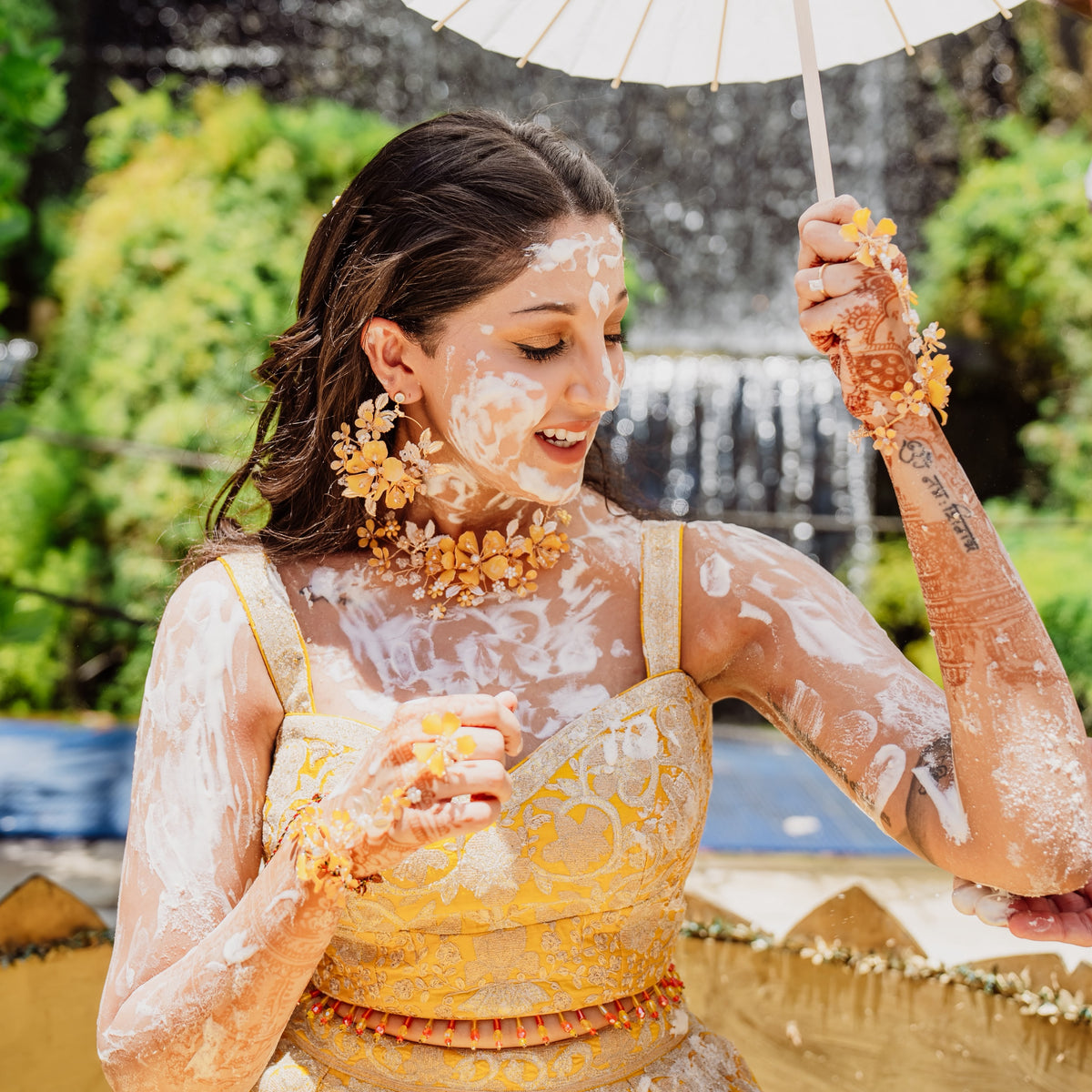 Real bride Lavina Sabnani wearing the Helios jewellery set at her haldi ceremony, featured in Vogue
