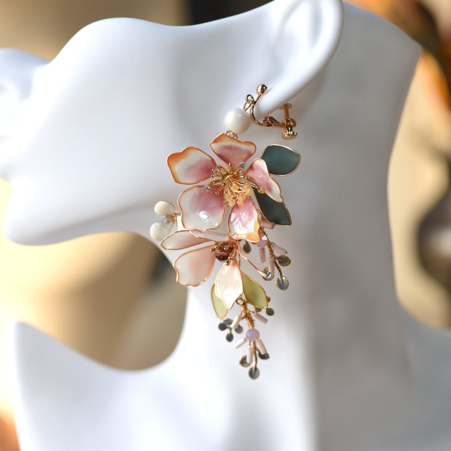Imogen handcrafted blush pink ivory resin floral drop earrings crystal blue grey bead clusters teal leaf on mannequin

