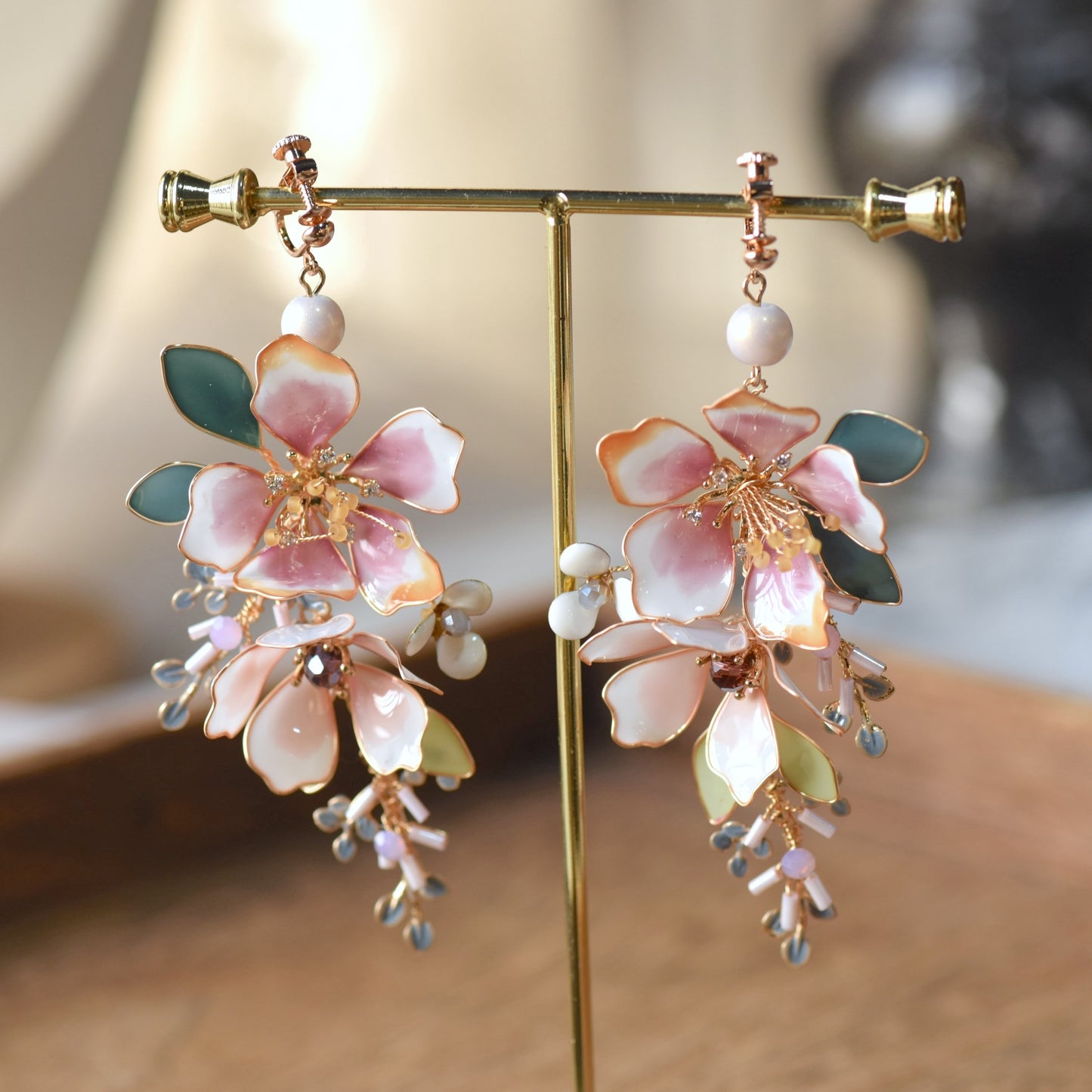 Imogen handcrafted blush pink ivory resin floral drop earrings crystal centre pale blue grey bead clusters rose gold stand
