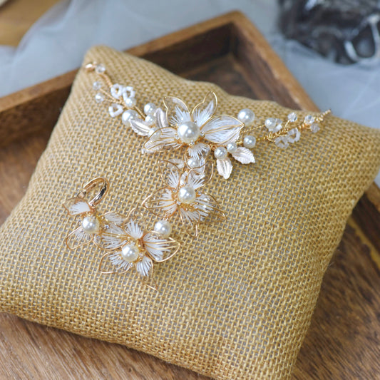 Juliana white resin floral bridal hand harness haath phool with pearls on jute cushion
