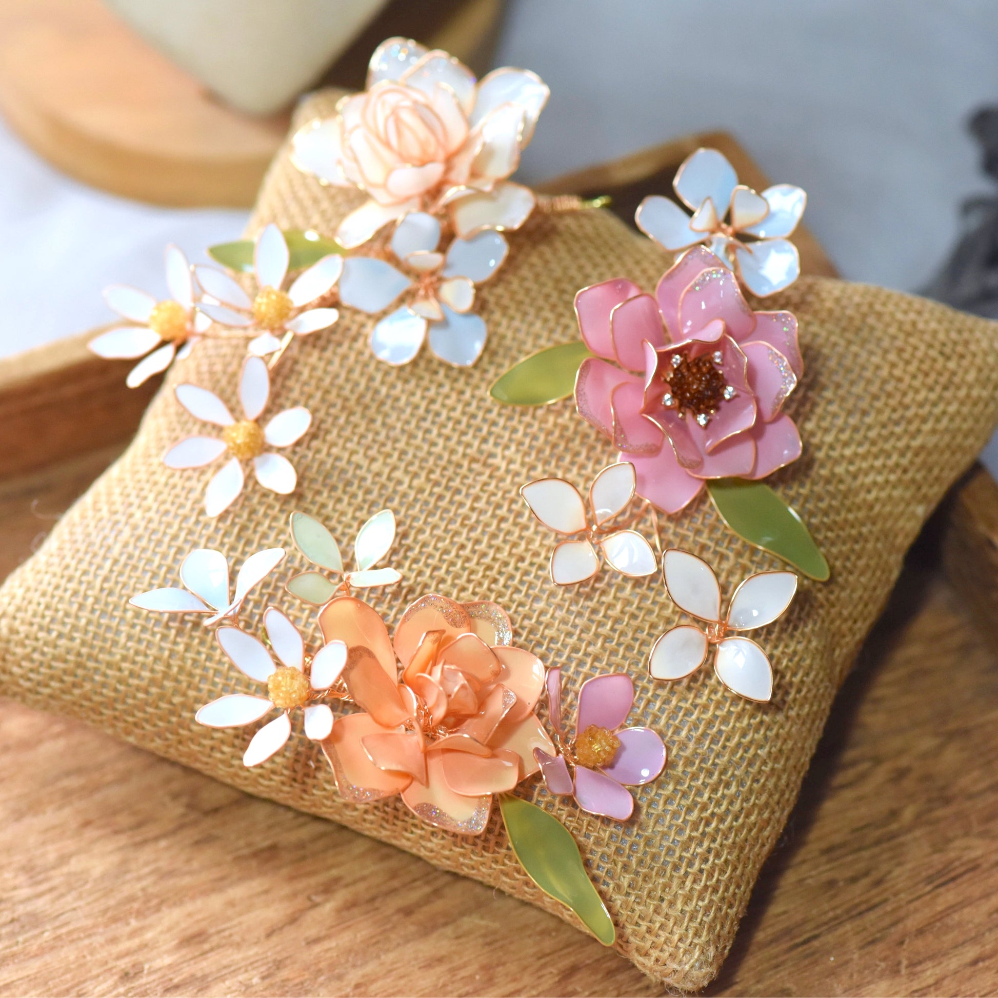 Lucia handcrafted floral hair accessory with pastel resin flowers and gold wire detailing