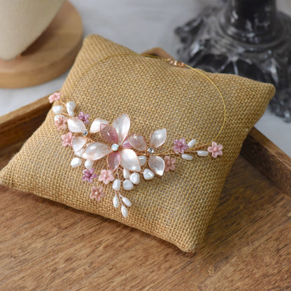 Madeline pink and lavender resin floral necklace on jute cushion
