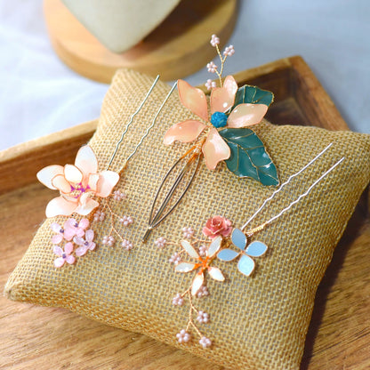 Micaela handcrafted floral hair accessory with peach resin petals and gold detailing