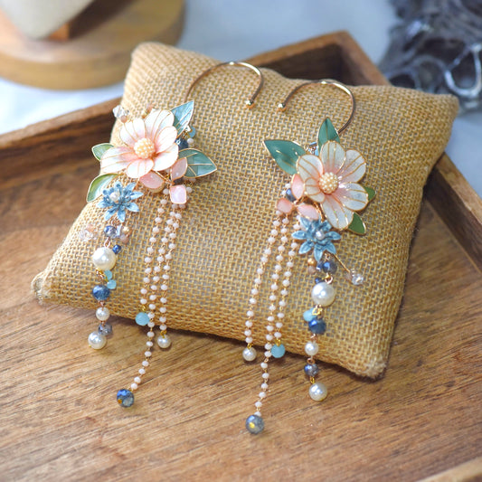 Milla blush peach resin floral ear cuff set of 2 with sage green leaves on jute cushion
