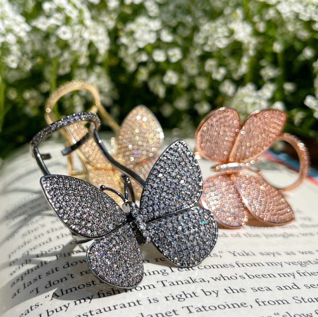 Moving Butterfly Ring adjustable zirconia butterfly rings displayed
