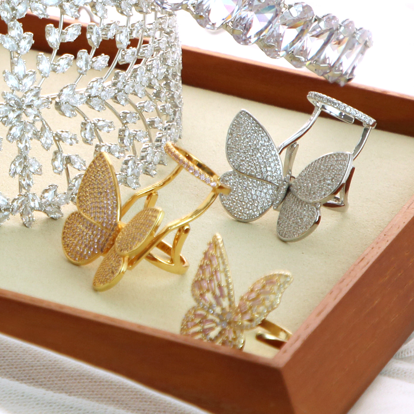 Moving Butterfly Rings in gold and silver displayed in gift box
