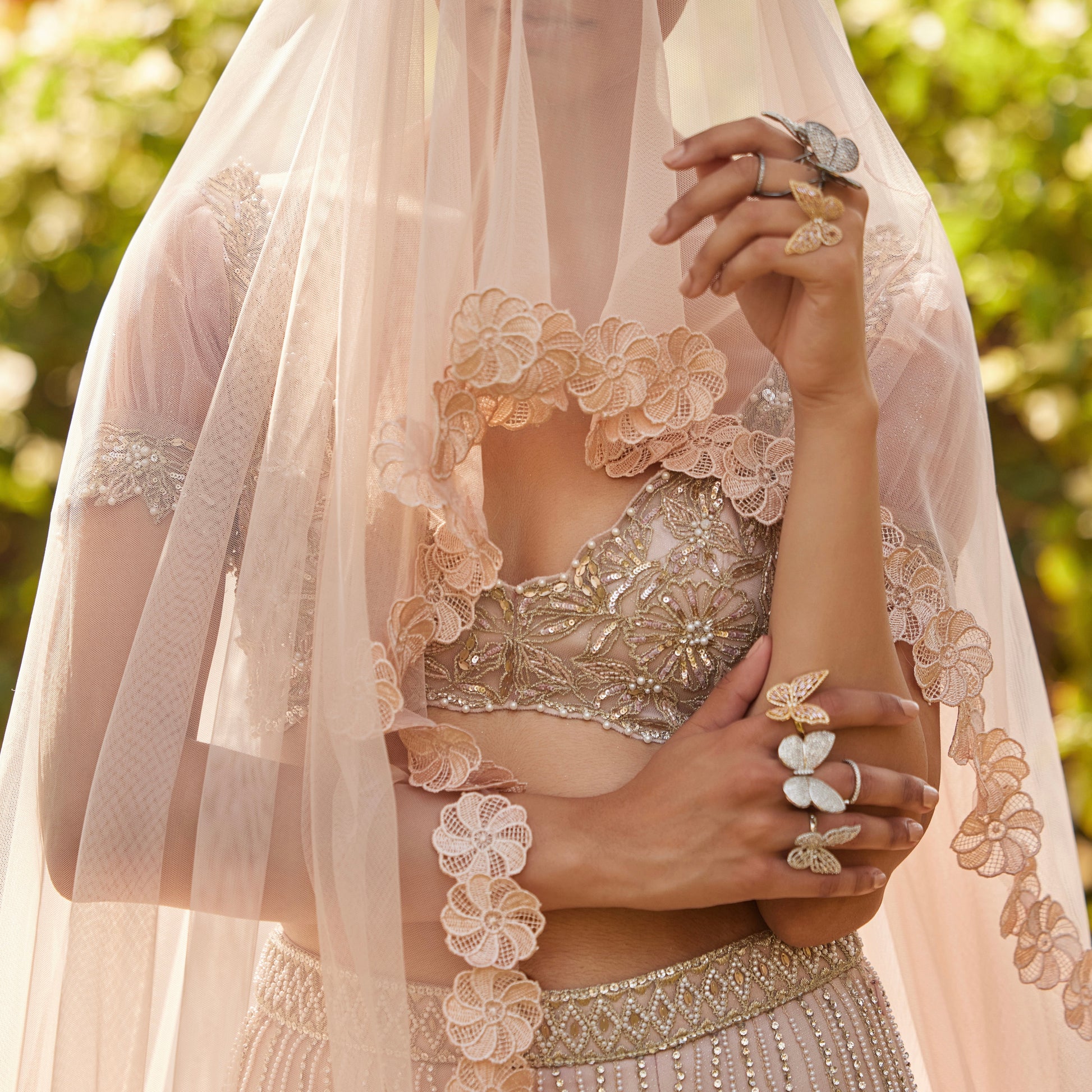 Model wearing the Moving Butterfly Ring in a bridal veil look
