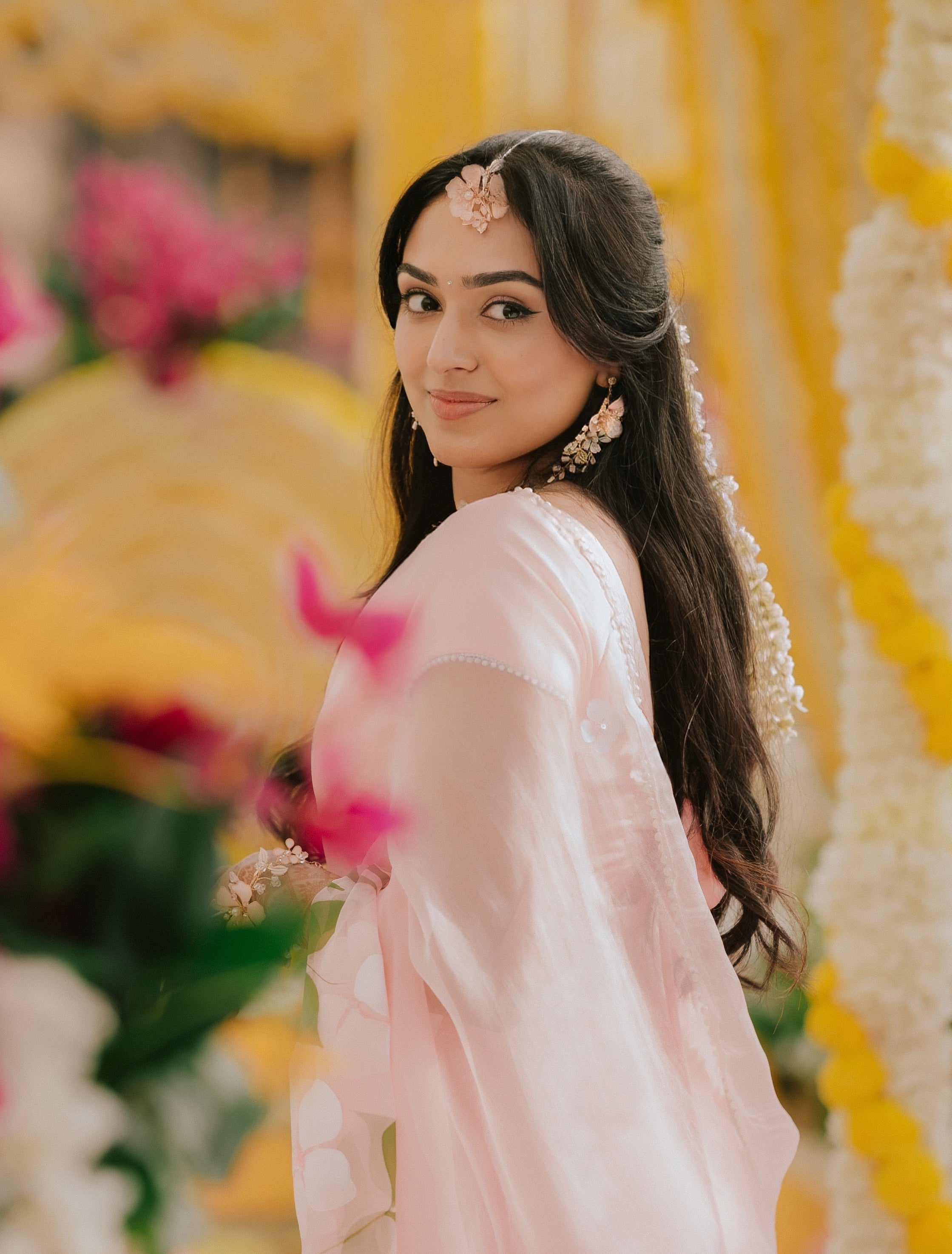 Bride Menaka Kathiresan wearing The Vintage Snob Eos Maang Tika Ellie Earrings Valerie Necklace Eos Hand Harnesses haldi
