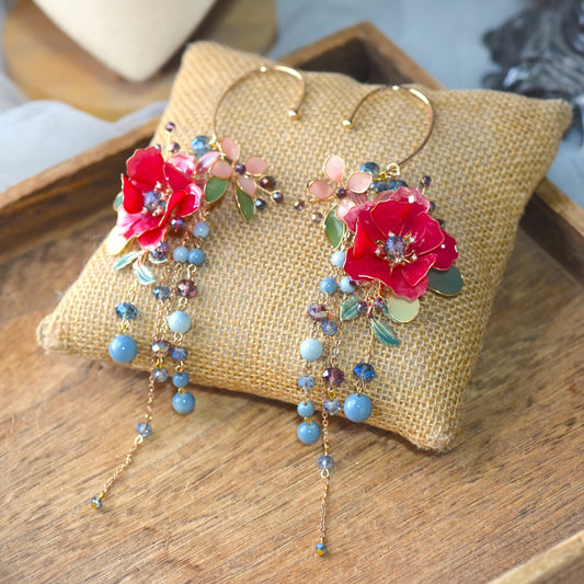 Raphael handcrafted floral resin ear cuff featuring deep red rose petals, cascading blue bead chains and soft gold wire detailing