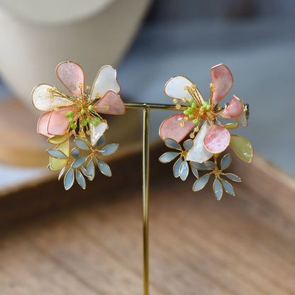 Lightweight handcrafted resin floral earrings with blush pink and lavender resin petals
