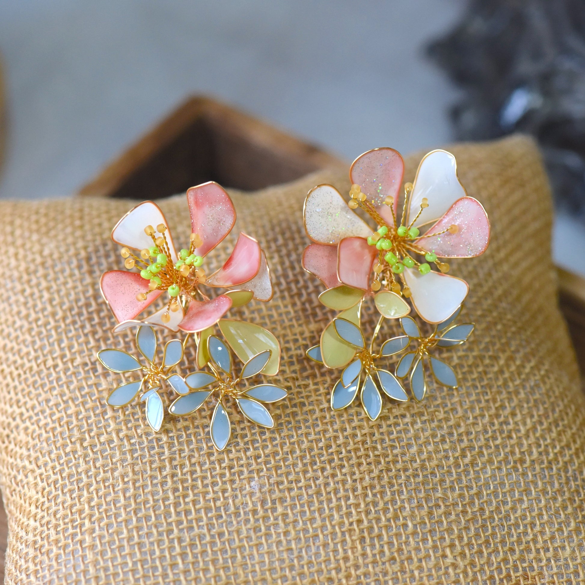 Handcrafted resin floral statement earrings in soft pastel tones, lightweight and flowy
