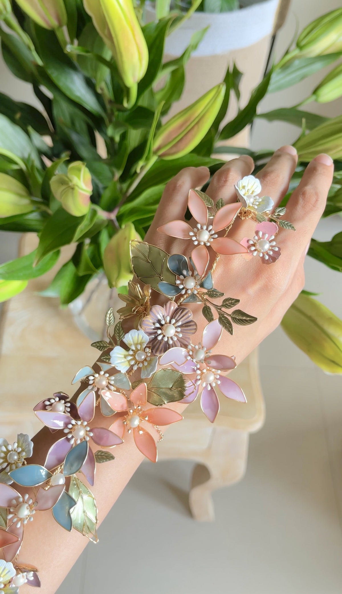 Sabrina multicolour resin floral haath phool styled with greenery
