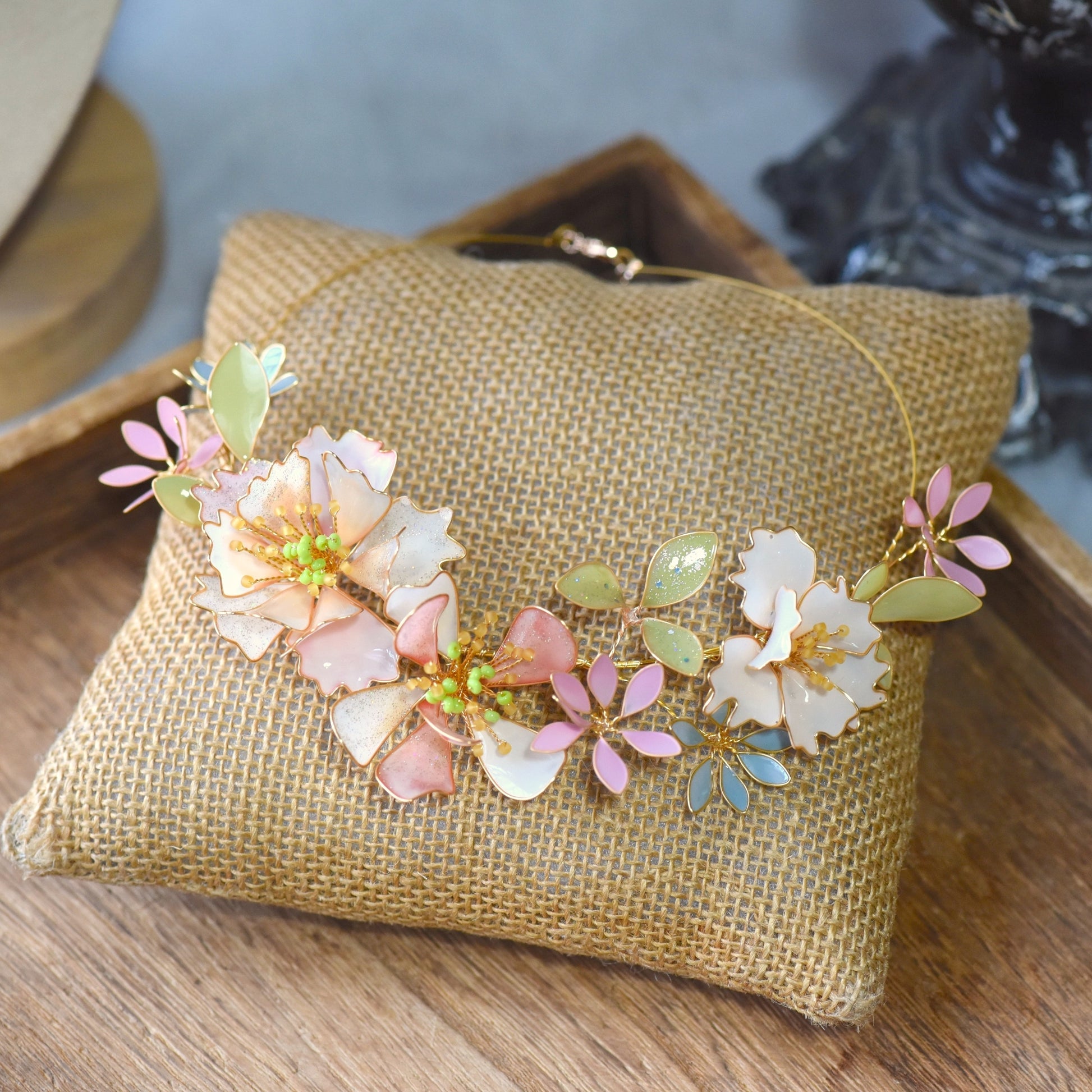 Sadie floral resin necklace with handcrafted pastel flowers in blush pink, ivory, pastel blue and sage green, finished with soft gold detailing