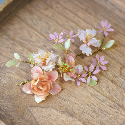 Sadie floral hair accessory with handcrafted resin flowers in blush pink, ivory and sage green, finished with soft gold wire detailing