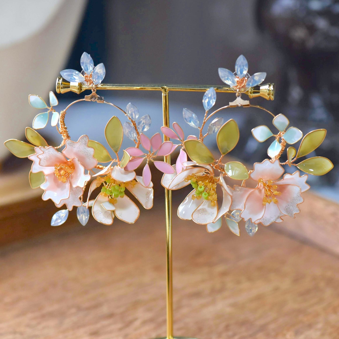 Sadie handcrafted pastel resin floral hoop earrings blush pink powder blue marquise crystal mint gold on stand
